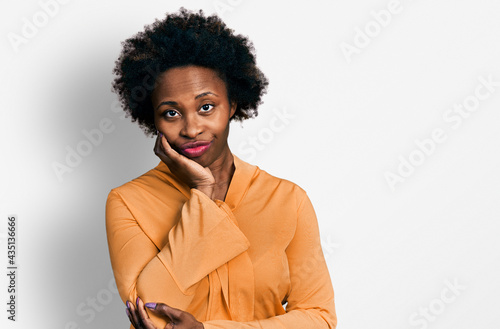 African american woman with afro hair wearing elegant shirt thinking looking tired and bored with depression problems with crossed arms. © Krakenimages.com