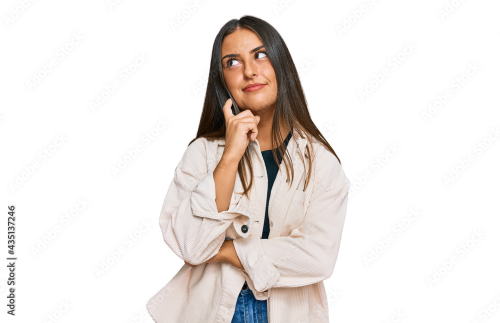Beautiful hispanic woman wearing casual clothes serious face thinking about question with hand on chin, thoughtful about confusing idea Beautiful hispanic woman wearing casual clothes serious face thinking about question with hand on chin, thoughtful about confusing idea