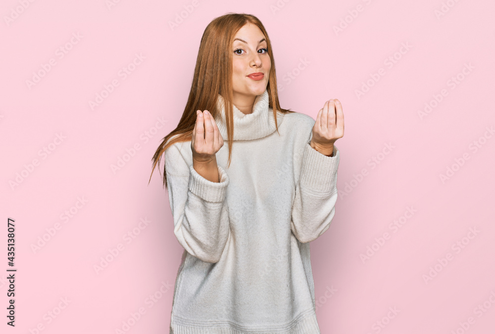 Young irish woman wearing casual winter sweater doing money gesture with hands, asking for salary payment, millionaire business Young irish woman wearing casual winter sweater doing money gesture with hands, asking for salary payment, millionaire business