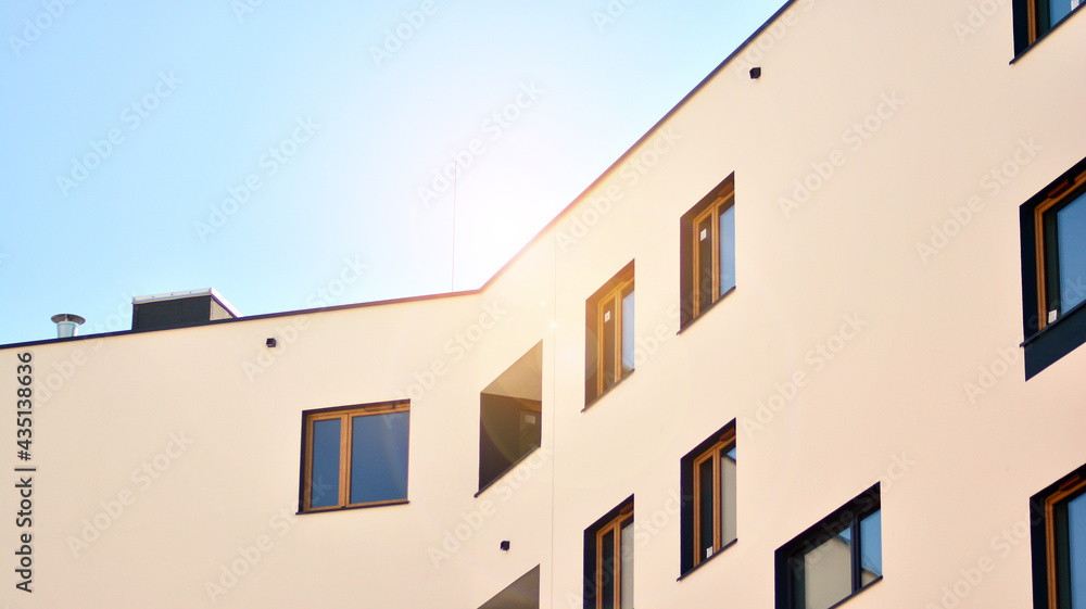 Condominium and apartment building with  symmetrical modern architecture in the city downtown.