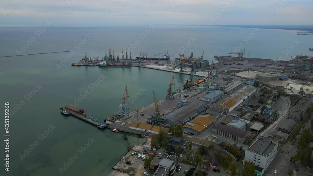 Drone flies over seaside with Sea Port in Small Bay on sea of Azov