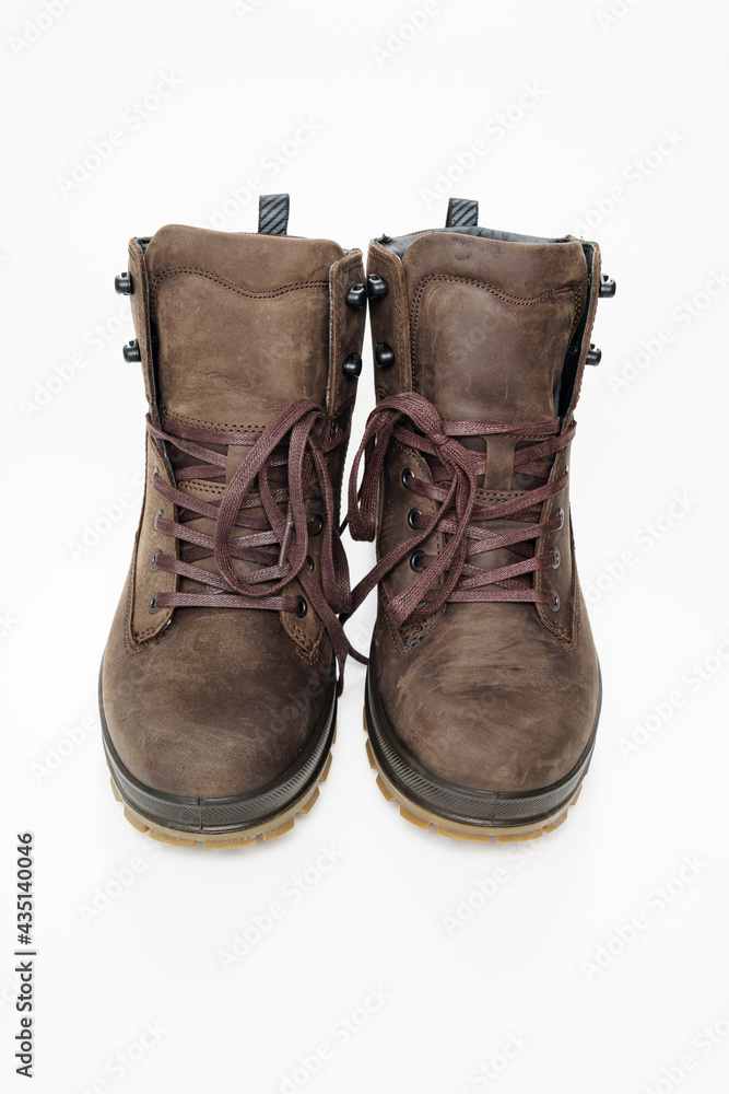 winter brown leather men's shoes with a fluted sole on a white background.