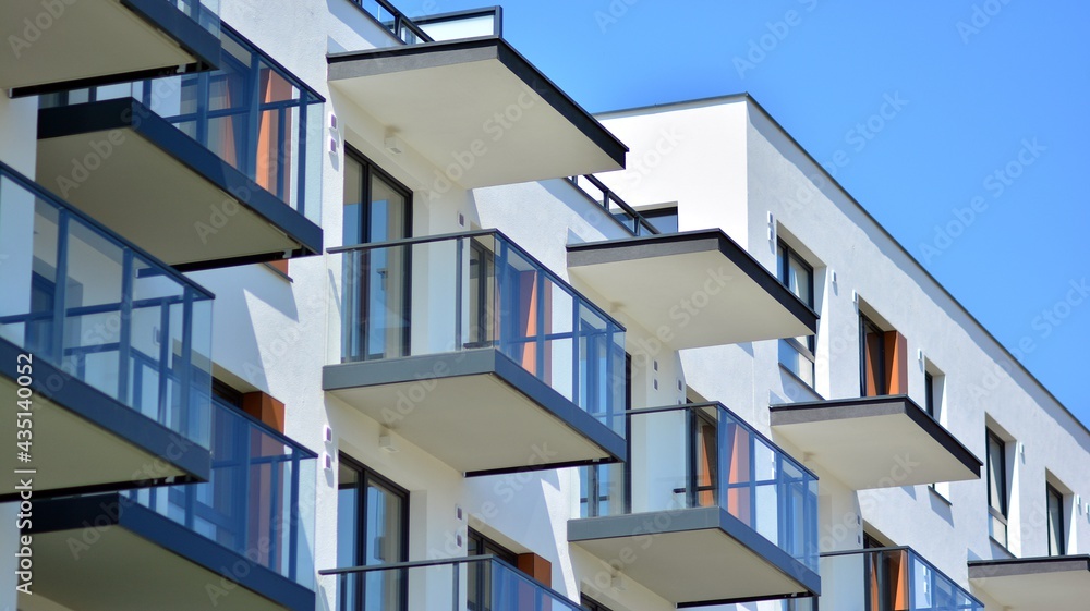 Condominium and apartment building with symmetrical modern architecture in the city downtown. Condominium and apartment building with symmetrical modern architecture in the city downtown.