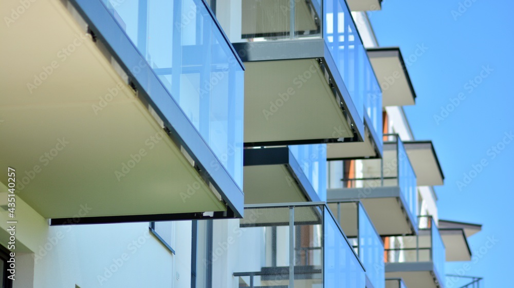 Fototapeta premium Condominium and apartment building with symmetrical modern architecture in the city downtown.