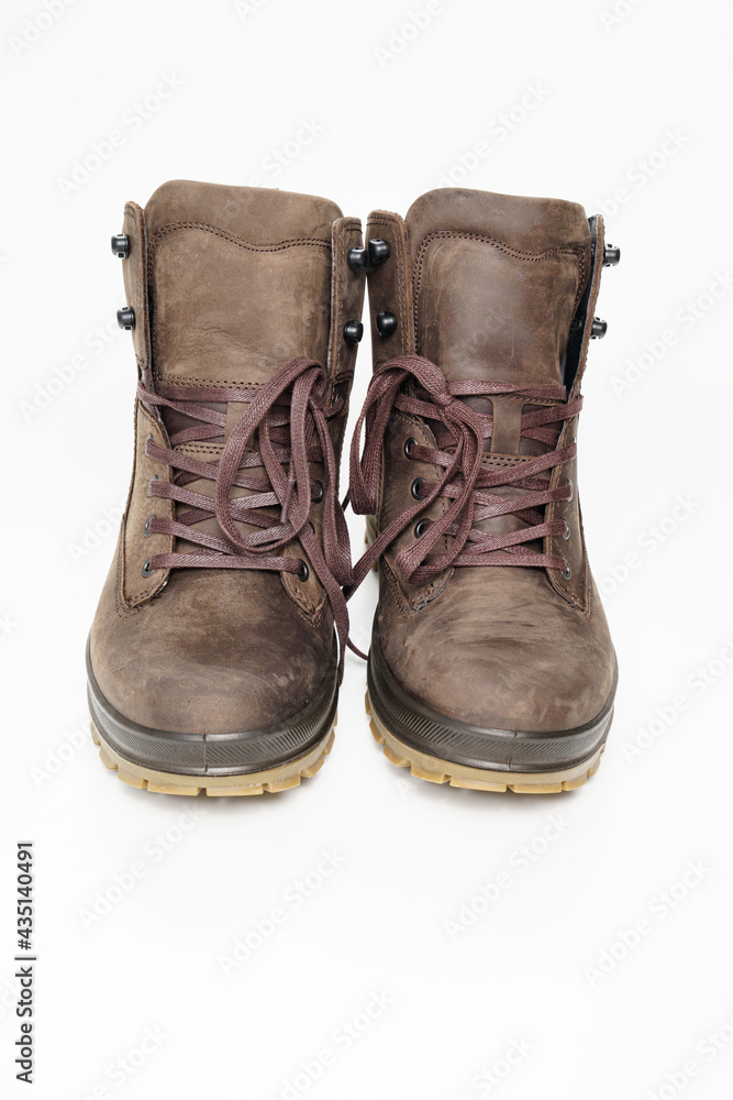 winter brown leather men's shoes with a fluted sole on a white background. winter brown leather men's shoes with a fluted sole on a white background.