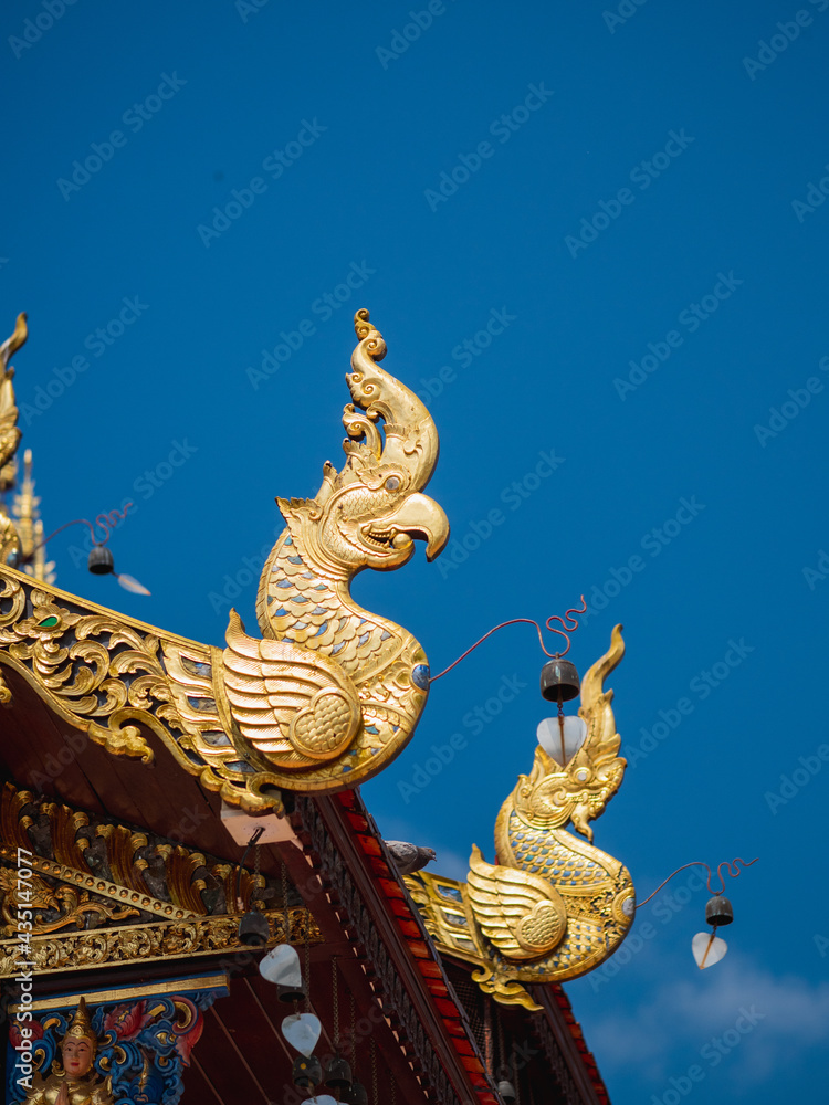 Fototapeta premium Golden wood carving art in Lanna style decorated in the temples.