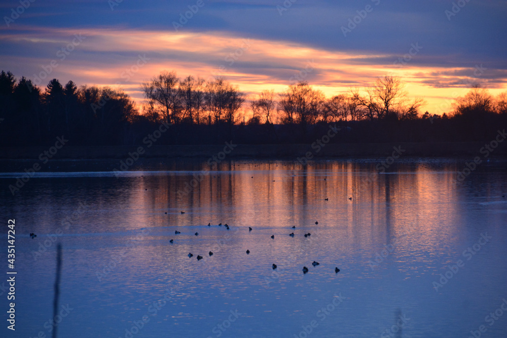 Fabulous sunset reflection on lake water and  horizon