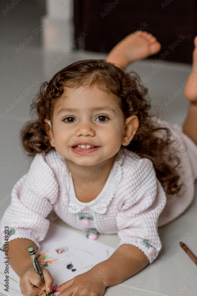 Girl in pajamas drawing and smiling coloring and painting Girl in pajamas drawing and smiling coloring and painting