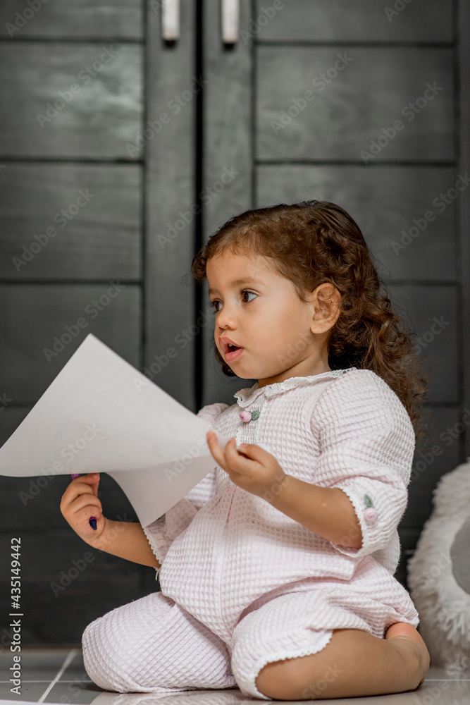 Girl in pajamas drawing and smiling coloring and painting Girl in pajamas drawing and smiling coloring and painting