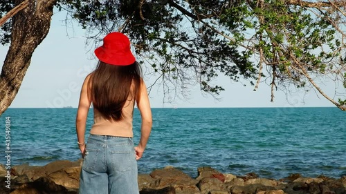 Happy carefree sensual woman with red hat