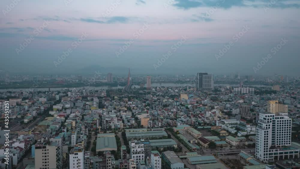 Cinematic time-lapse view of an industrialized city in Asia from night to day. Cinematic time-lapse view of an industrialized city in Asia from night to day.