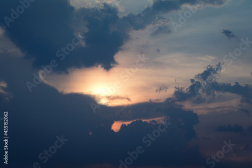 Beautiful sunset sky above clouds with dramatic light
