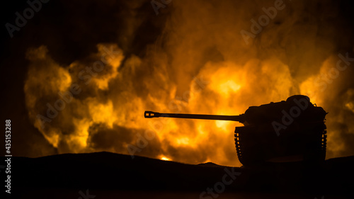 War Concept. Military silhouettes fighting scene on war fog sky background, World War Soldiers Silhouette Below Cloudy Skyline At night. Battle in ruined city. photo