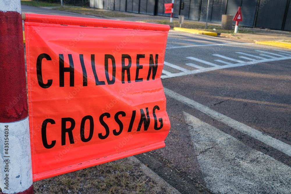 Children crossing road sign flag
