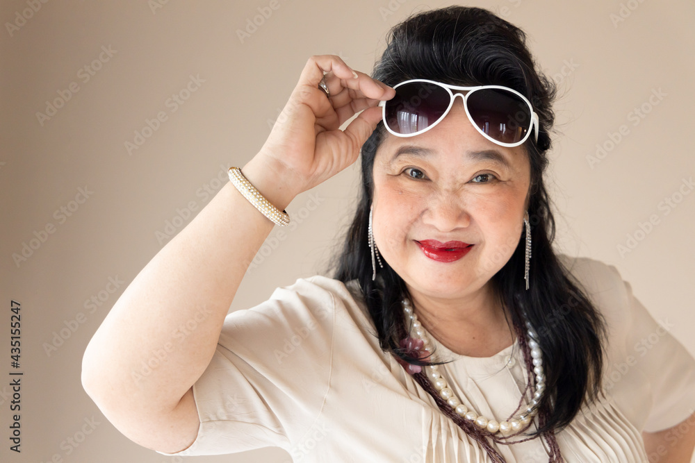 Happy senior in style with good quality of life, fashionable old woman looking at you Happy senior in style with good quality of life, fashionable old woman looking at you