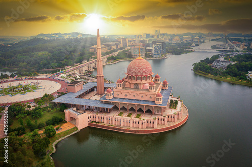 Aerial View Of Putra Mosque with Putrajaya City Centre with Lake at sunset in Putrajaya, Malaysia. photo