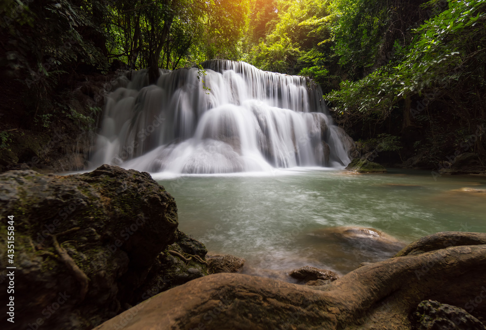 Fototapeta premium Waterfalls in the beautiful nature. Magic Water falls famous in Kanchanaburi, Thailand. Huai Mae Khamin Waterfall - 7-tier water falls in a national park.