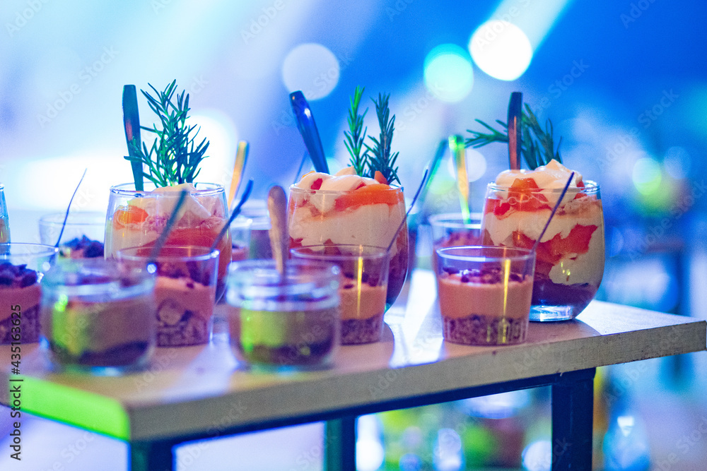 Rich and colorful desserts elegantly served in individual glasses.