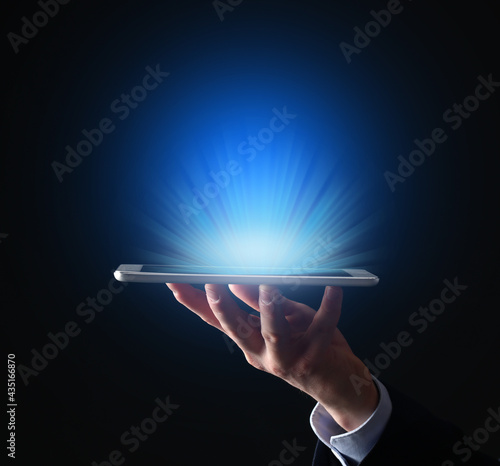 Businessman with tablet com...