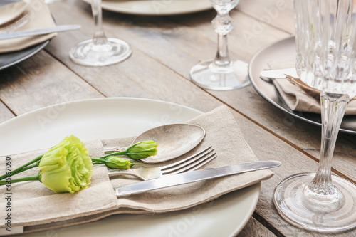 Beautiful table setting on wooden background, closeup