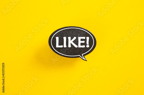 Like speech bubble isolated on yellow paper background