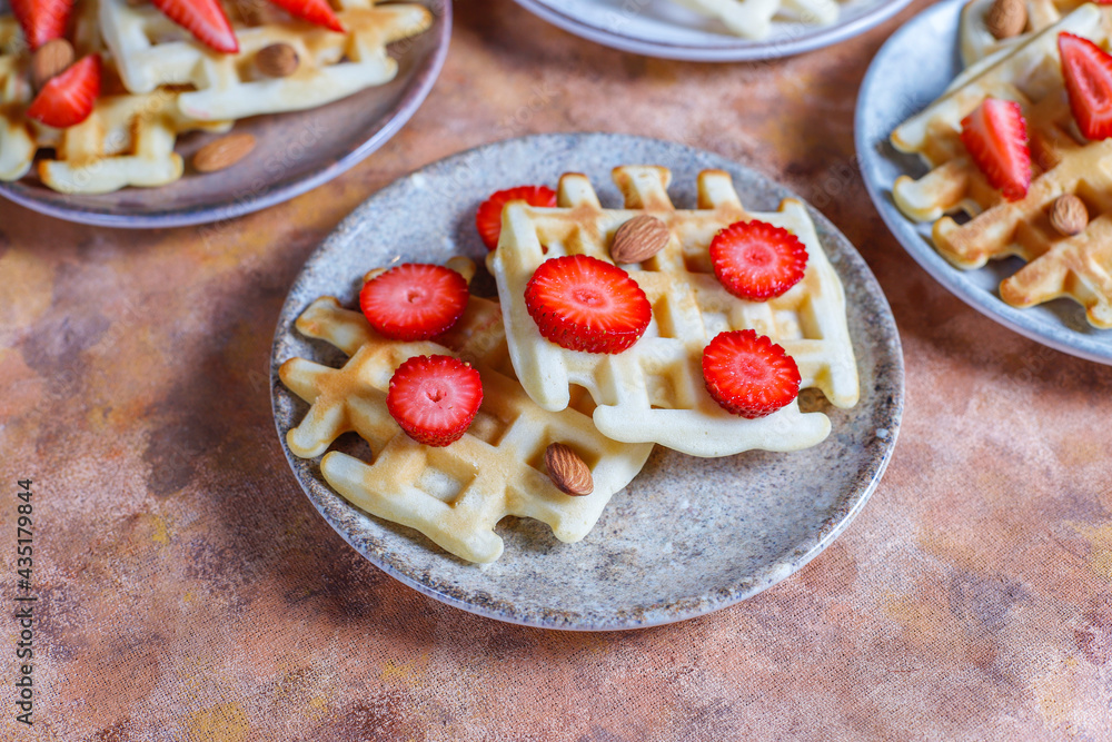 Homemade belgian waffles with strawberries.