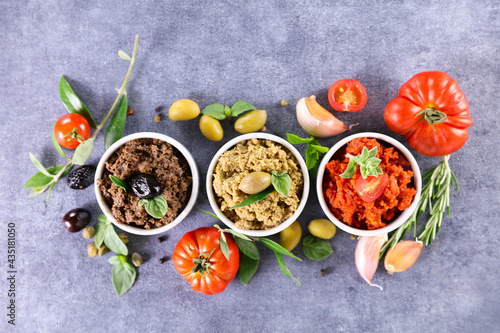 assorted of tapenade with olive, tomato and basil