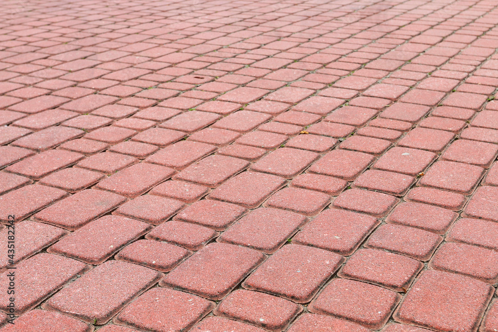 Red cobbled street, urban background. Red cobbled street, urban background.