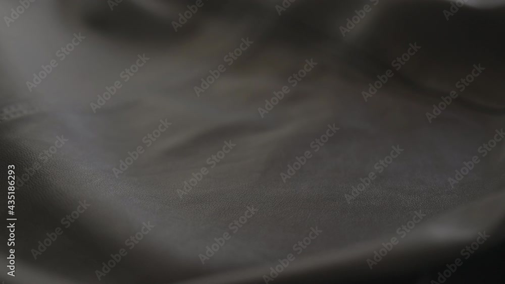 Slow motion handheld shot of soft gray leather jacket Slow motion handheld shot of soft gray leather jacket