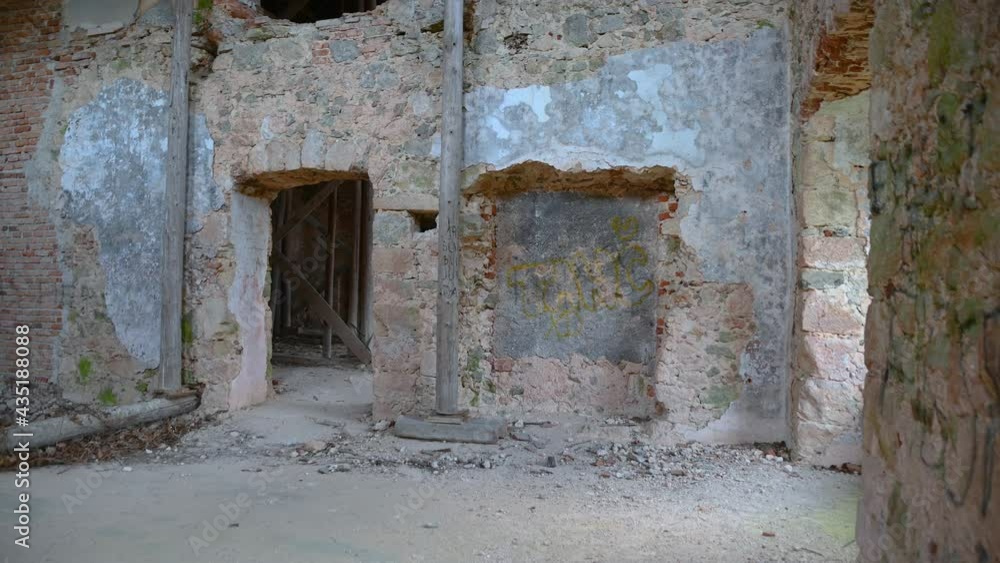Interior of the old abandoned renaissance building without inner walls. Historic mansion in Slovenia. Countryside ruined building. Left pan, wide angle Interior of the old abandoned renaissance building without inner walls. Historic mansion in Slovenia. Countryside ruined building. Left pan, wide angle