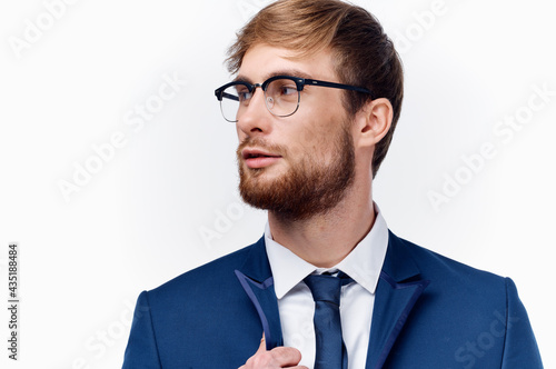 portrait of sexy man wearing glasses business finance and blue jacket tie model