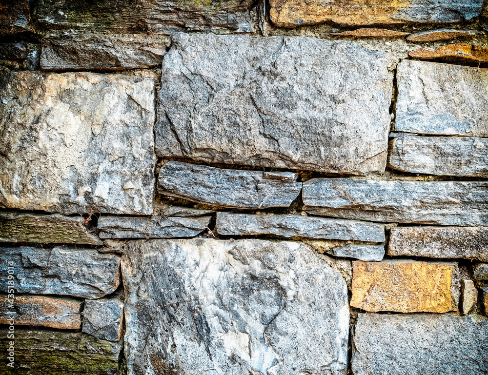 Fototapeta premium grey rough stone wall closeup, seamless pattern textured background