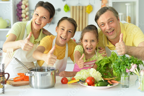 Cute family cooking together in kitchen