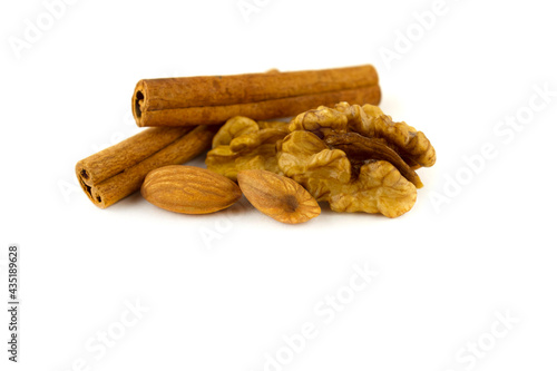 Walnut and almond seeds with cinnamon sticks