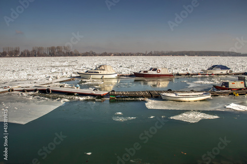 Belgrade, Serbia - Boats surrounded by blocks of ice on the Danube River