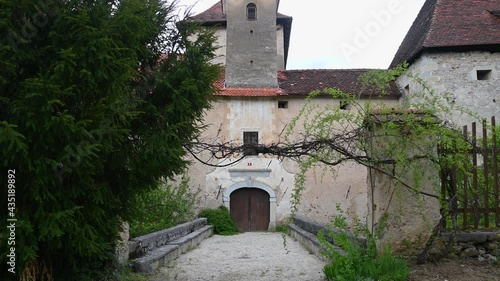 Gracar Turn castle in Slovenia. View of entrance bridge. Beautiful and historic building. 14th century historic castle backyard walls. Wide angle, tilt up photo