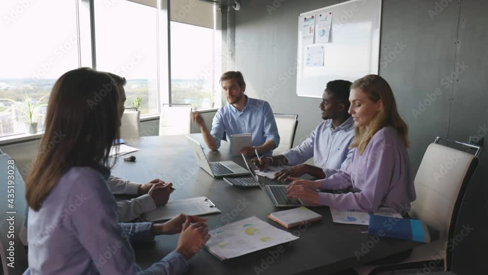 Group of happy progressive business people working on startup together. Group of happy progressive business people working on startup together.