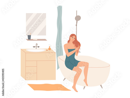 Woman in bath towel applies hair conditioner in bathroom after shower at home. Hair care