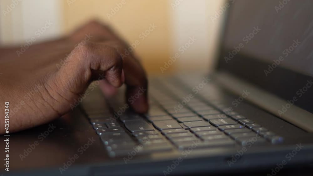 Closeup shot of hands of an Indian teen typing on the keyboard of laptop. Young teen types on a laptop to complete his project. Online education concept Closeup shot of hands of an Indian teen typing on the keyboard of laptop. Young teen types on a laptop to complete his project. Online education concept