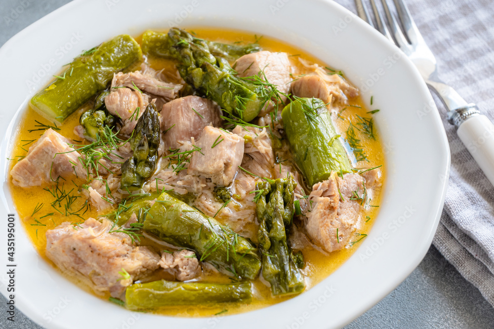 Turkey stew in gravy with asparagus and dill. Meat goulash Turkey stew in gravy with asparagus and dill. Meat goulash