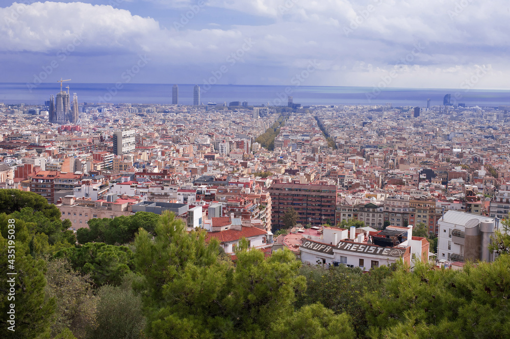 Sagrada Familia dominates the panorama of Barcelona from the top of the hill