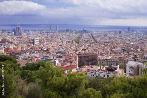 Sagrada Familia dominates the panorama of Barcelona from the top of the hill © Alevtina
