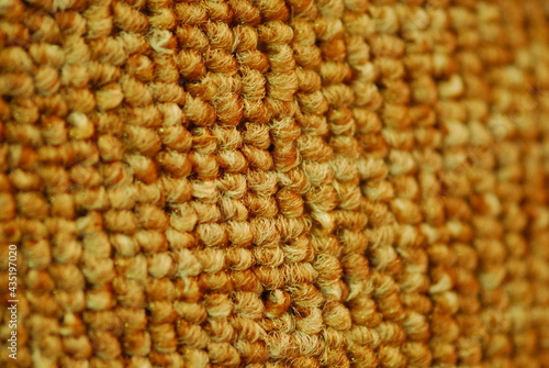 Close up of gold textured carpet