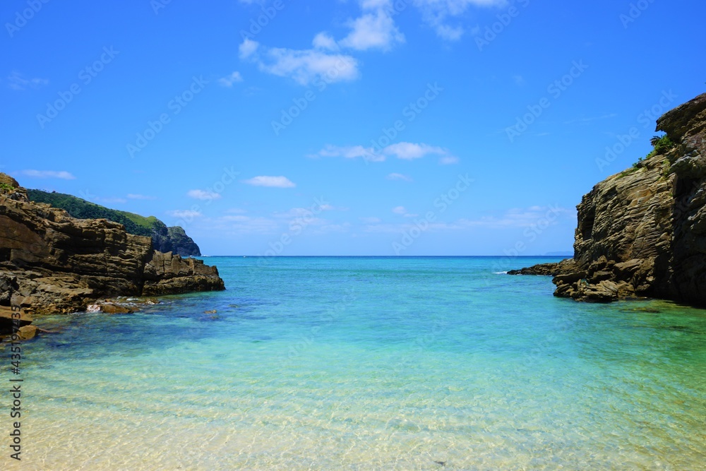 Beautiful summer scenery. calm waves on the blue water. Yuhina Beach in Zamami island, Okinawa, Japan - 日本 沖縄 座間味島 ユヒナ 海岸 Beautiful summer scenery. calm waves on the blue water. Yuhina Beach in Zamami island, Okinawa, Japan - 日本 沖縄 座間味島 ユヒナ 海岸