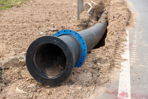 Wallpaper Mural Construction site with new Water Pipes in the ground. sewer pipes to repair or restore in street city Torontodigital.ca