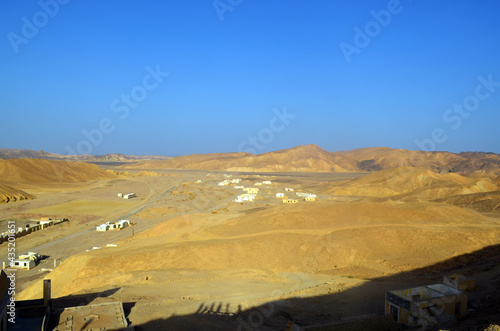 Desert. A beautiful landscape in the middle of the rocky mountains in a magnificent  beautiful landscape. Egypt. Blue sky. Copy space. Homes in the middle of the desert.