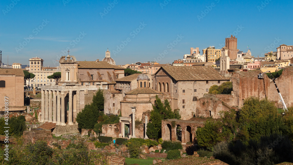 Ruins of the Roman Forum. View
the ruins of the ancient city against the backdrop of the Troyan market