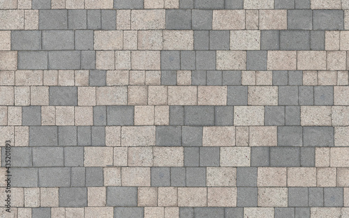 Stone pavement texture. Abstract background of cobblestone pavement close-up. Seamless texture. Perfect tiled on all sides.