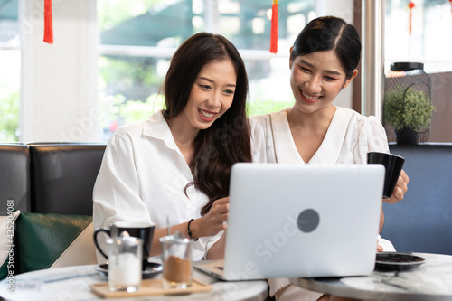 Free Download young couple woman talking and using laptop computer in free time - GFXLoad