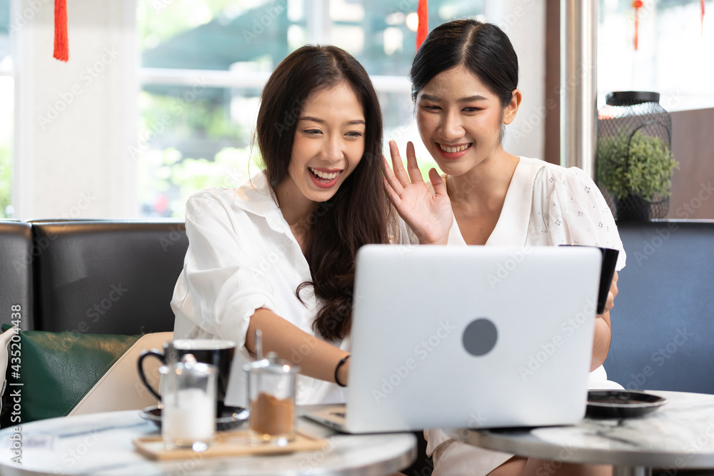 young couple woman talking and using laptop computer in free time young couple woman talking and using laptop computer in free time